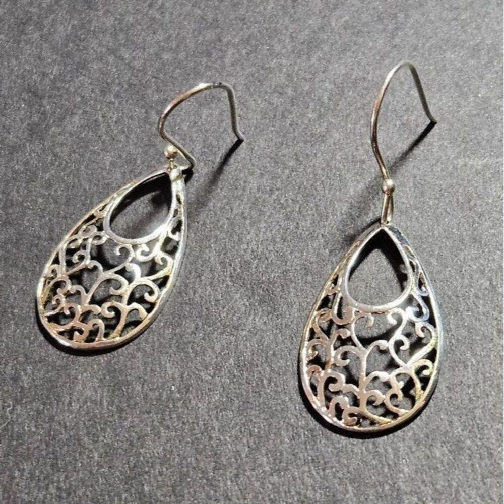 Silver tone filigree teardrop shaped earrings
